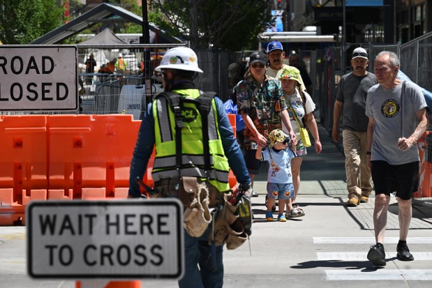 People walk around continued construction on 16th Street in Denver on May 12, 2025. (Photo by Helen H. Richardson/The Denver Post)
