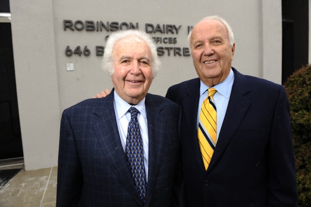 The Robinson brothers Eddie, left, and Dick outside the family dairy offices in Denver on Dec. 18, 2008. (Photo by John Leyba/The Denver Post)