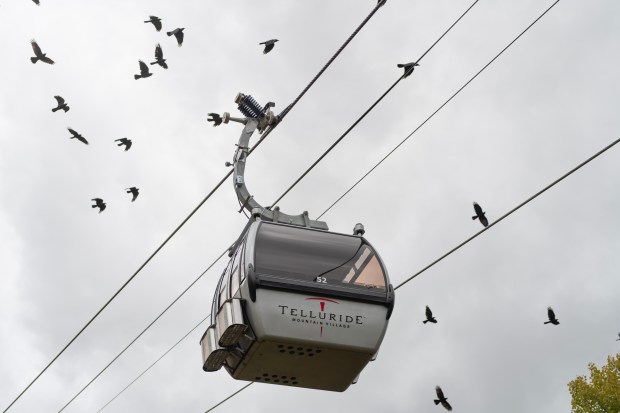 Passengers ride the Mountain Village gondola overlooking Telluride on Tuesday, Sept. 30, 2025. (Photo by William Woody/Special to The Denver Post)
