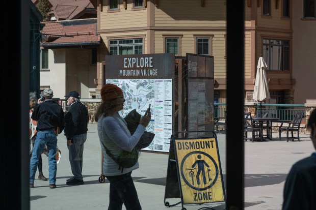 Visitors walk through the town of Mountain Village west of Telluride on Tuesday, Sept. 30, 2025. (Photo by William Woody/Special to The Denver Post)