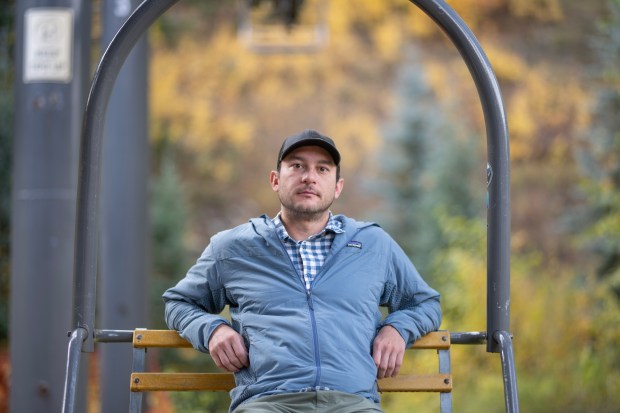 Telluride Ski Patrol Union President Graham Hoffman sits in an empty ski lift chair for a picture near the Oak Street ski lift in Telluride on Tuesday, Sept. 30, 2025. (Photo by William Woody/Special to The Denver Post)